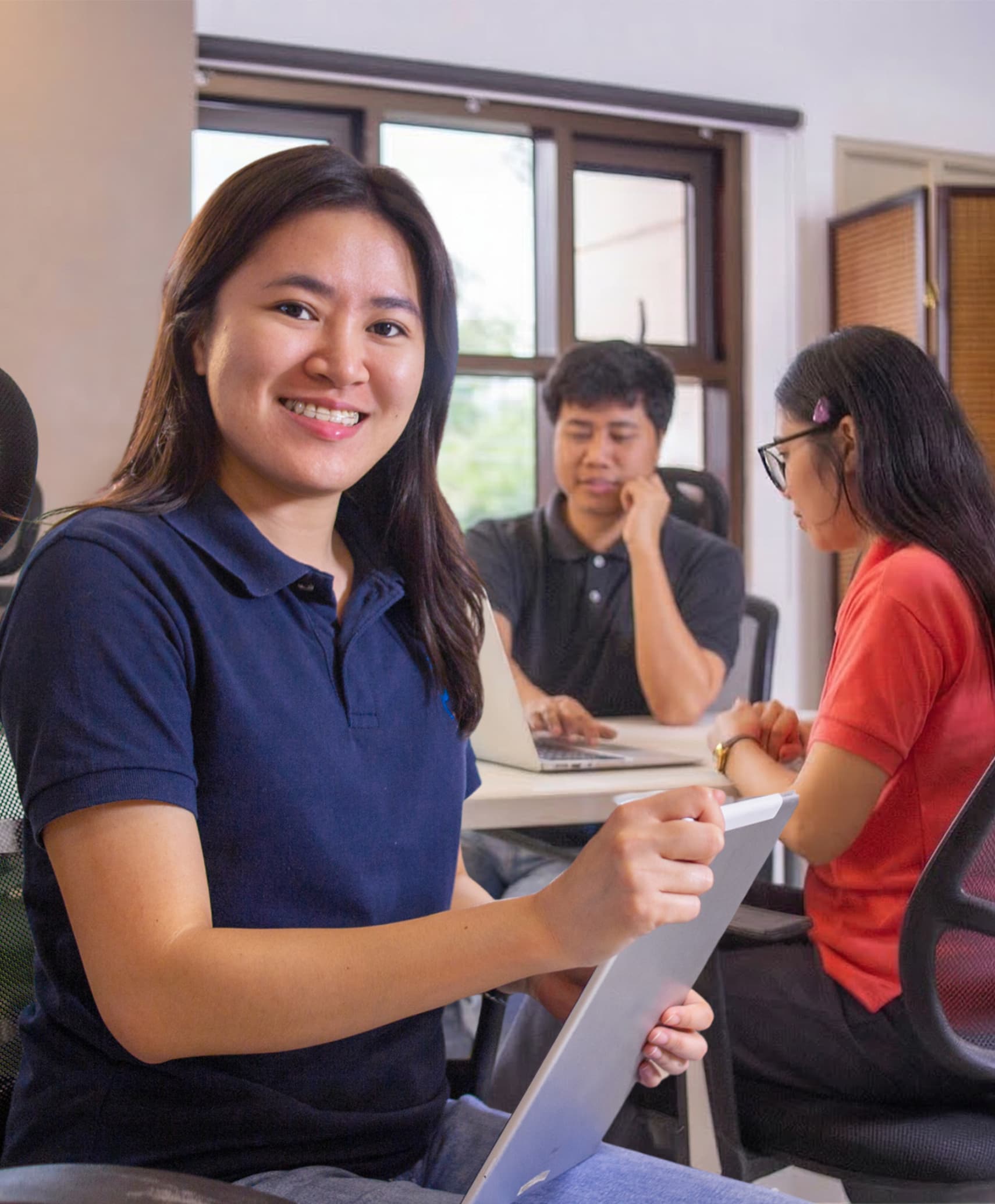 Yoonet team members meeting and collaborating in the office