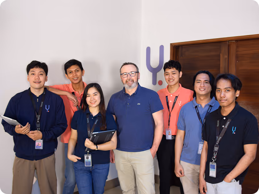 Yoonet team member at his desk with computer monitors